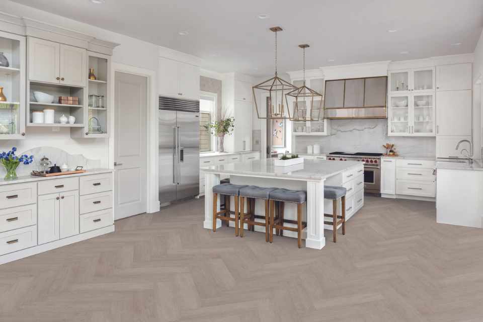 grey herringbone wood look luxury vinyl in white modern kitchen